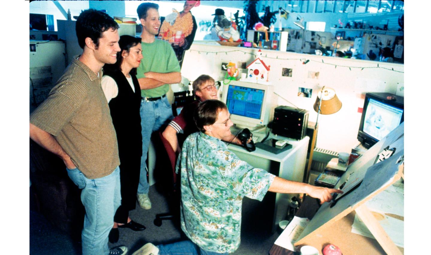 The Pixar crew working on 'Toy Story' with Lasseter, kneeling, in 1995.