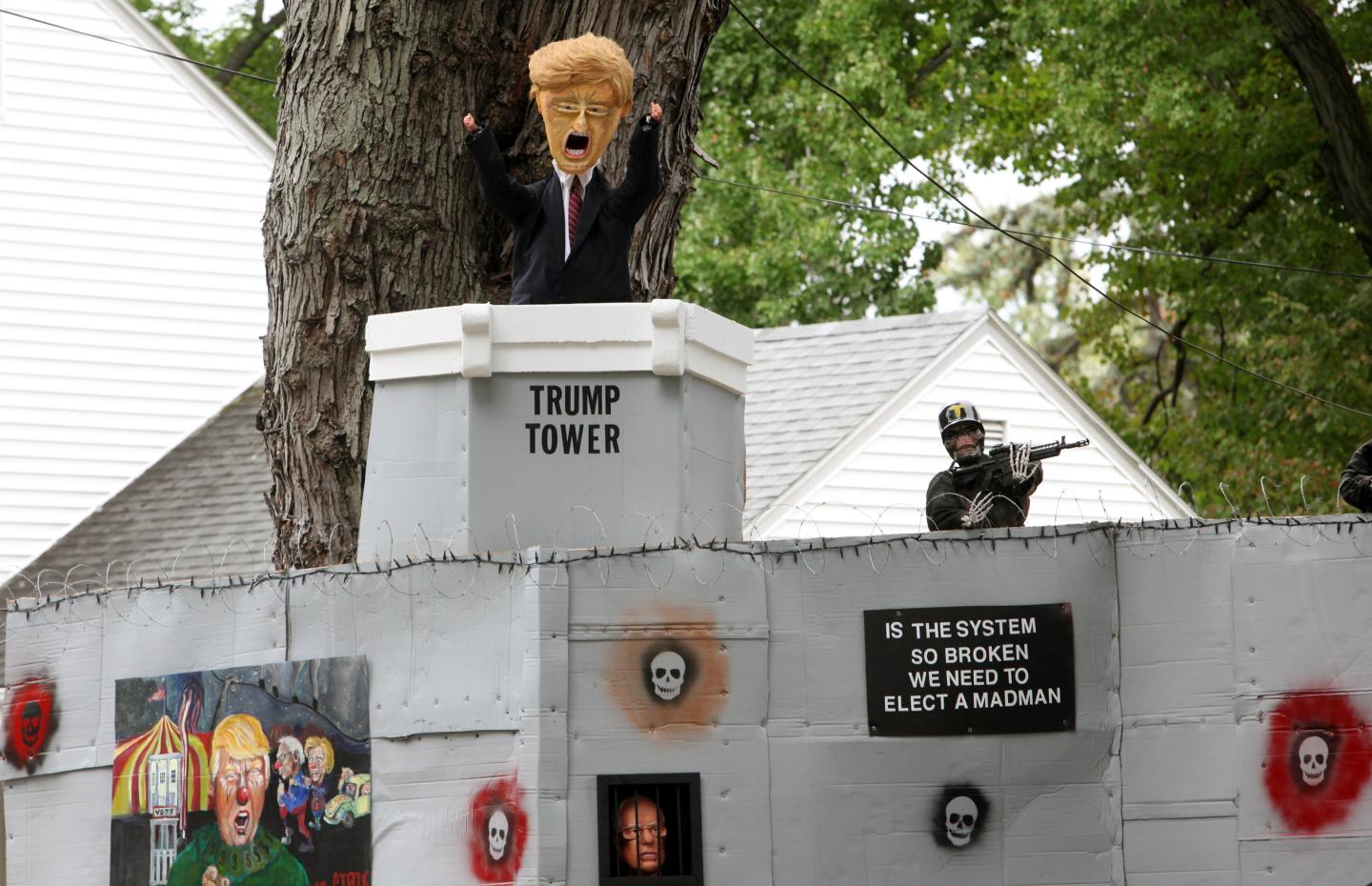 A Halloween display featuring a border wall and figures of Donald Trump, Hillary Clinton and Bernie Sanders is seen on the property of Matt Warshauer in West Hartford