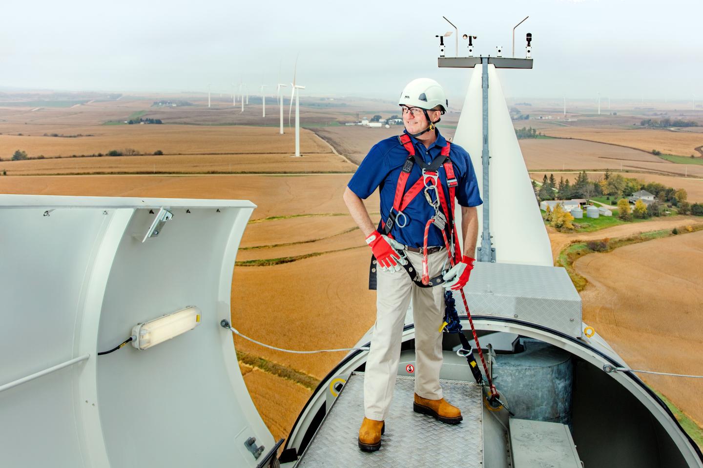 Greg Abel, head of Berkshire Hathaway Energy, atop one of the company's wind turbines in western Iowa. Abel has spearheaded the company's push into wind energy.