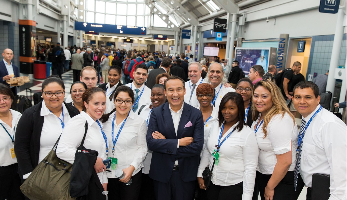 Munoz with United workers during a recent trip through O'Hare.