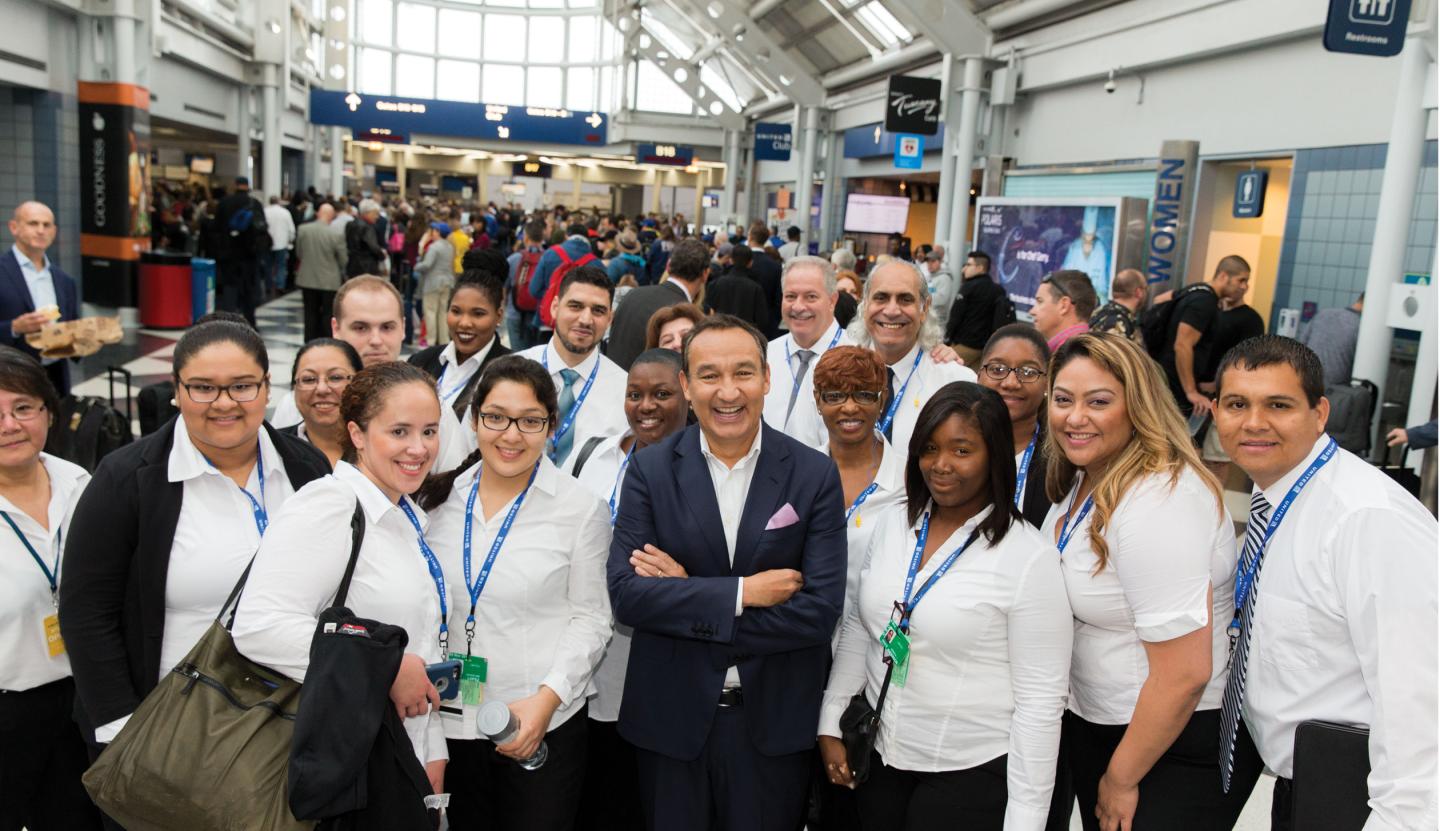 Munoz with United workers during a recent trip through O'Hare.