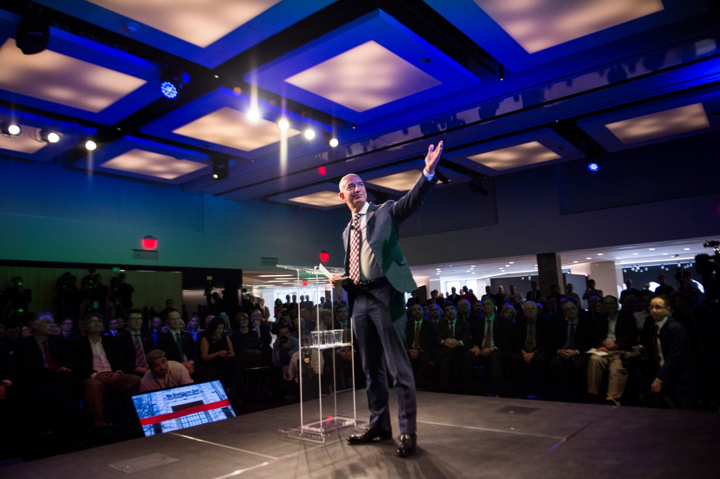 Freed Washington Post reporter Jason Rezaian, Secretary of State John Kerry, and Amazon founder and Washington Post owner Jeff Bezos during an opening ceremony for the new headquarters of The Washington Post.