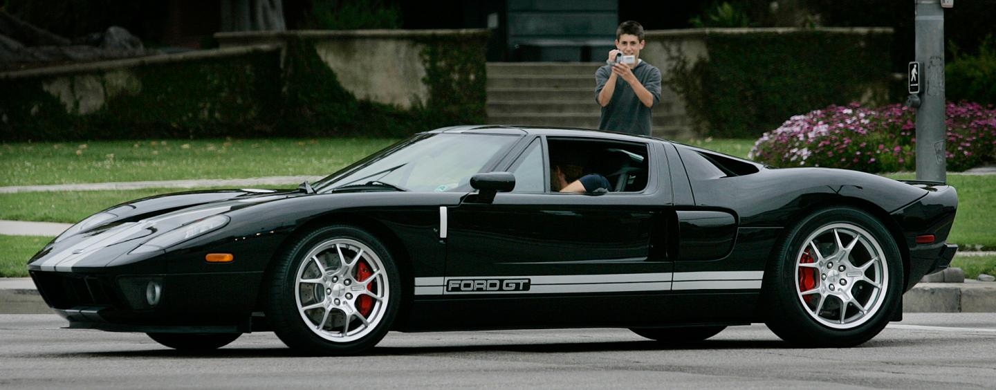04/23/2006.Beverly Hills. Brandon Nelson age 14 photographs a Ford GT. 13 year old Spyder Dobrofsky