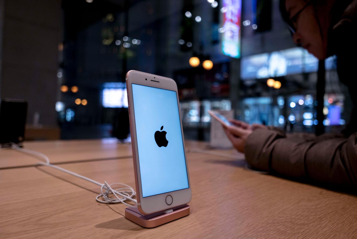 An iPhone 7 is exhibited in an Apple Store. Because of the