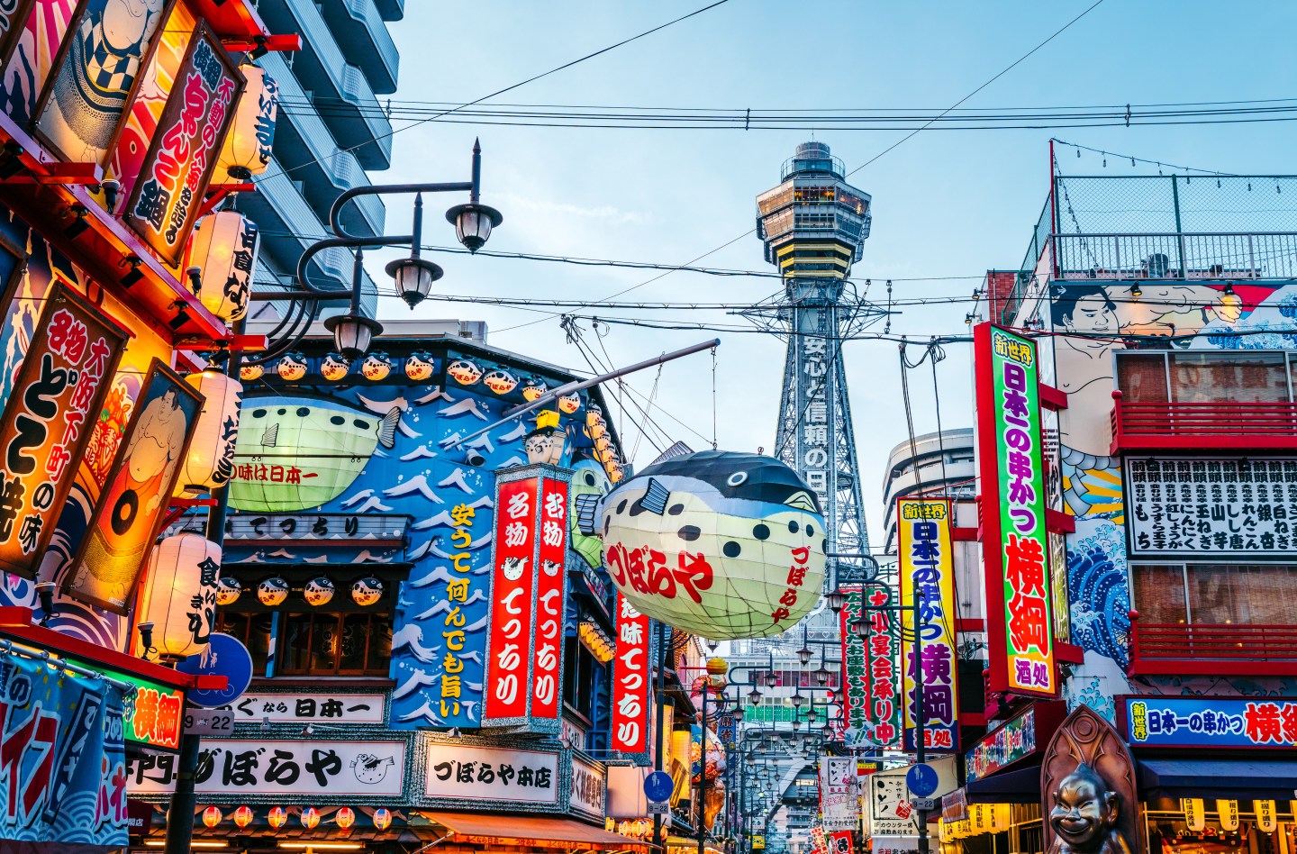 Osaka Tower and view of the neon advertisements Shinsekai district