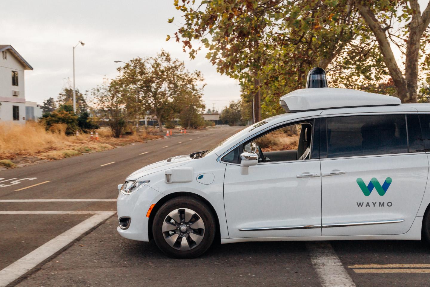 Google's Waymo self-driving autonomous Chrysler Pacifica minivan navigates the roads