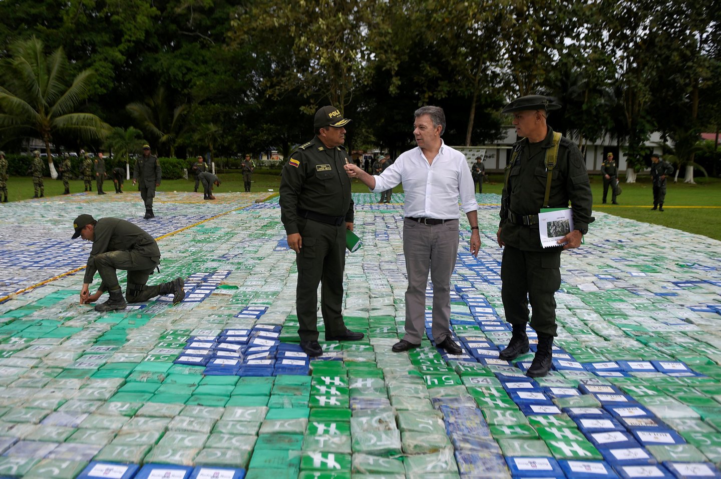 Colombia's President Juan Manuel Santos looks on after the seizure of more than 12 tons of cocaine in Apartado, Colombia