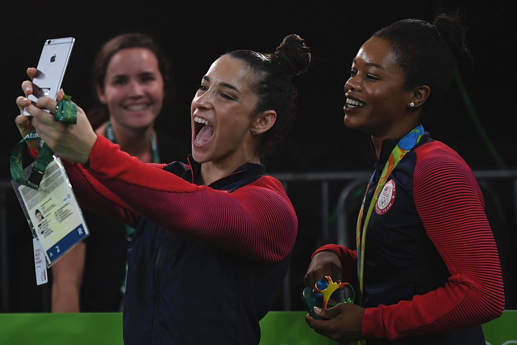 Aly Raisman and Gabby Douglas pose for selfie together at 2016 Olympics