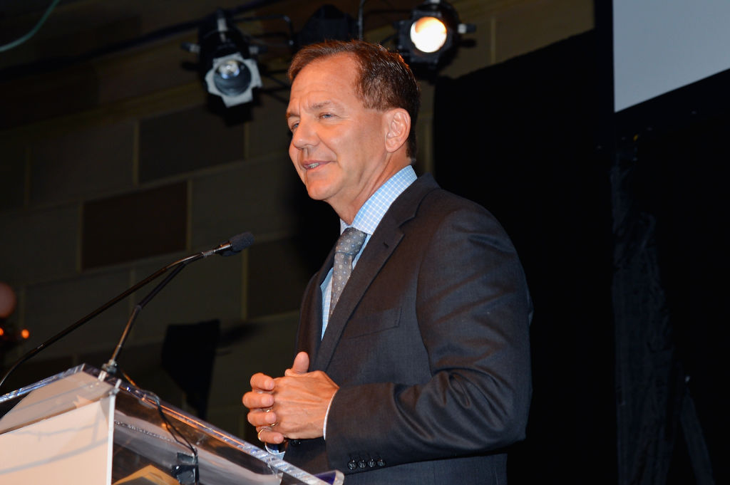Paul Tudor Jones speaking at a podium.