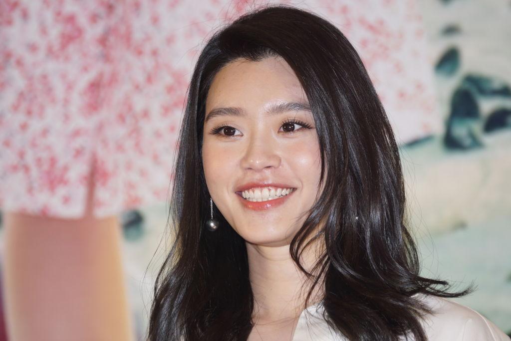 Chinese model Ming Xi smiles for the camera. 