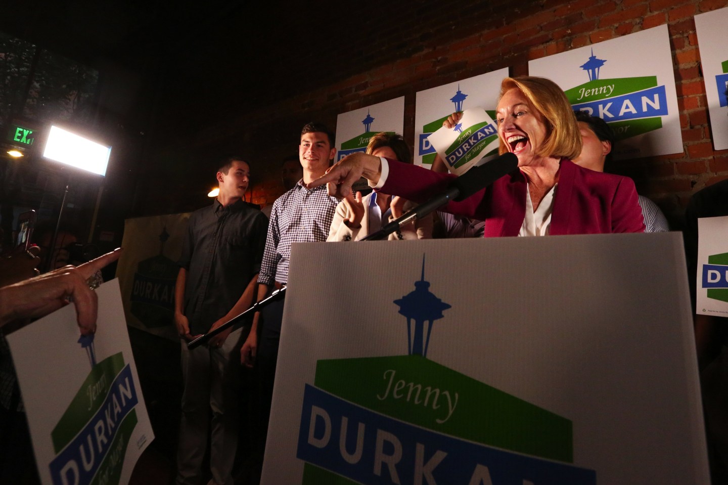 Seattle Mayoral candidate Jenny Durakn speaks at a podium at a political rally.