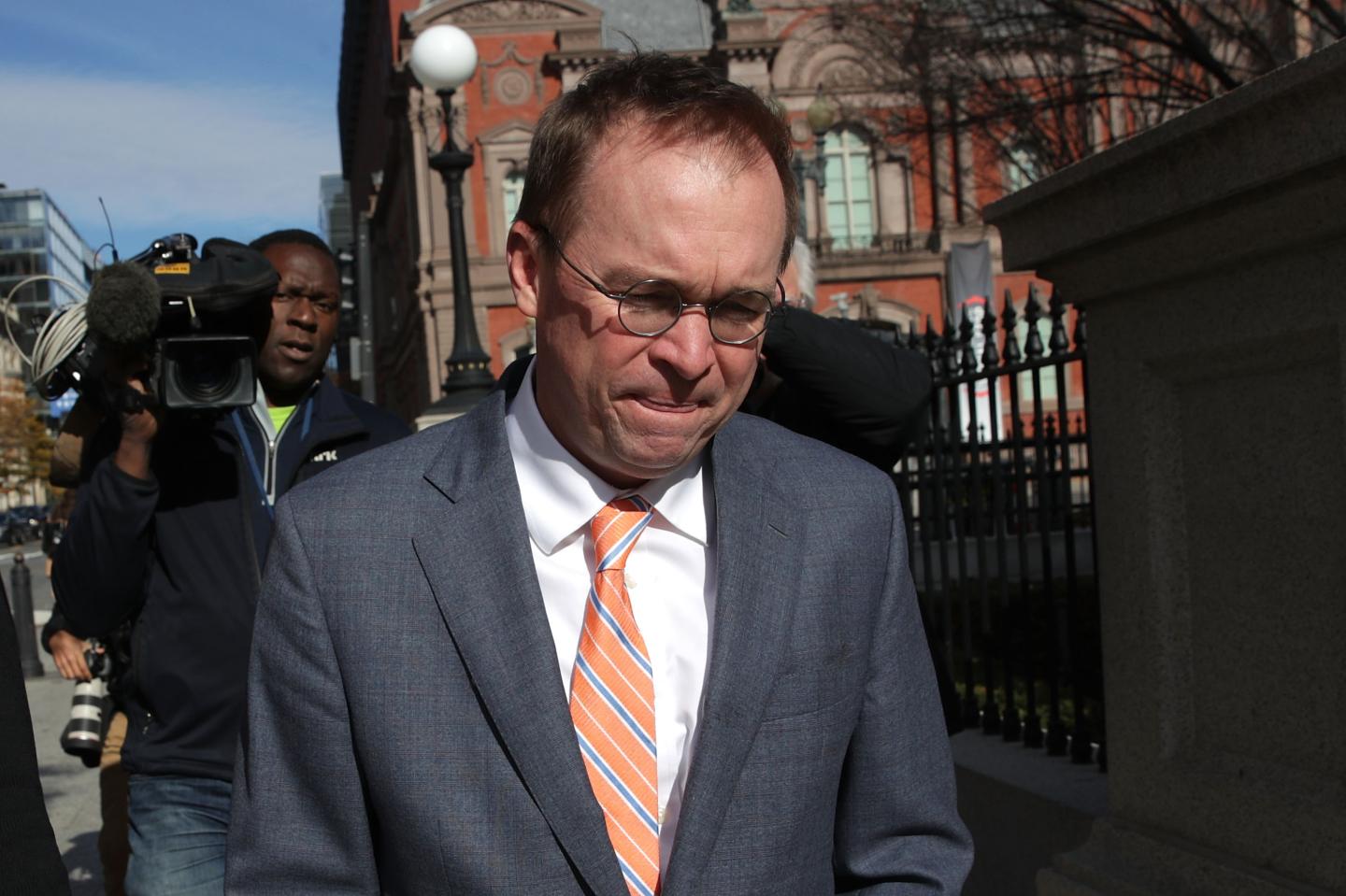 White House Budget Director Mick Mulvaney, President Donald Trump's pick for acting director of the Consumer Financial Protection Bureau, walks back to the White House from the CFPB building after he showed up for his first day of work on November 27, 2017 in Washington, DC.