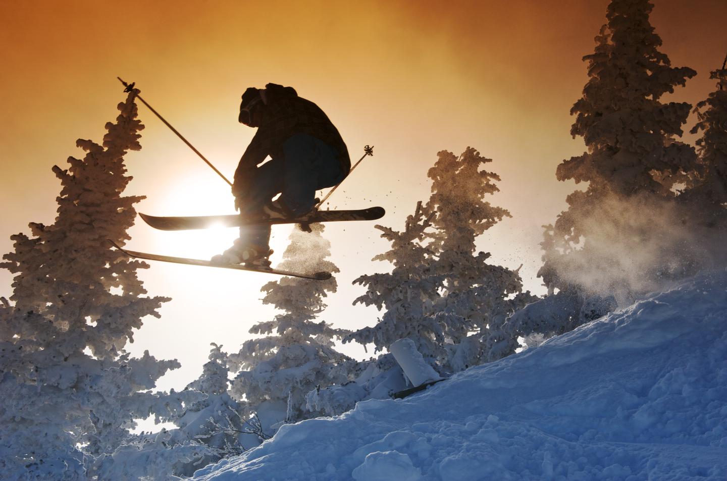 Airbourne skier at sunset at Jay Peak Ski Resort.