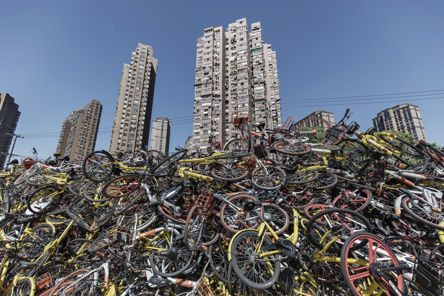 Ride-sharing bicycles sit in a pile in Shanghai, China, on Thursday, Sept. 12, 2017.