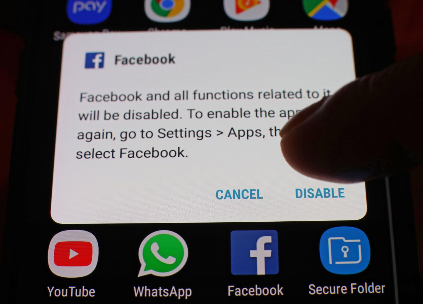 An option box to disable the Facebook app displayed on the screen of a mobile phone.