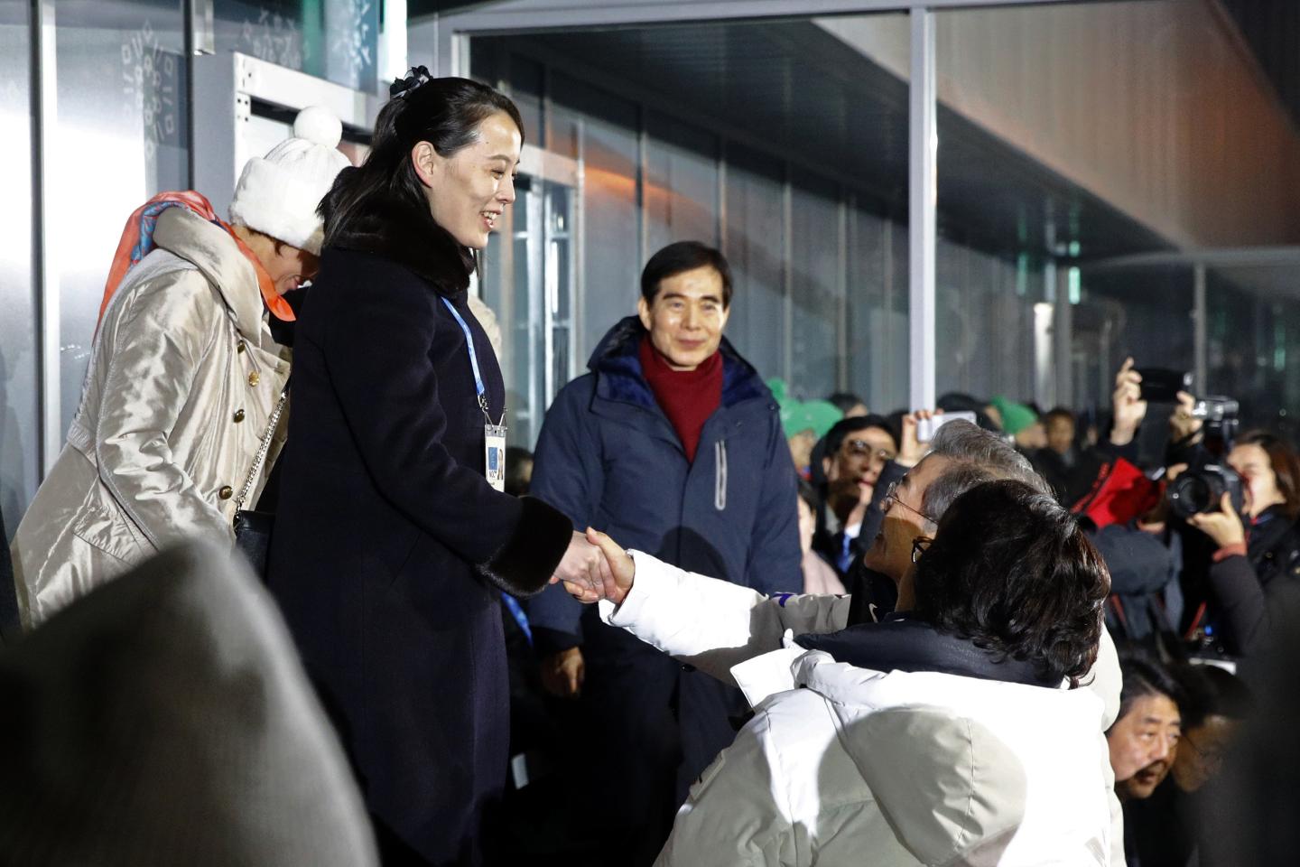 Kim Yo Jong, sister of North Korean leader Kim Jong Un, shakes hands with South Korean President Moon Jae-in.