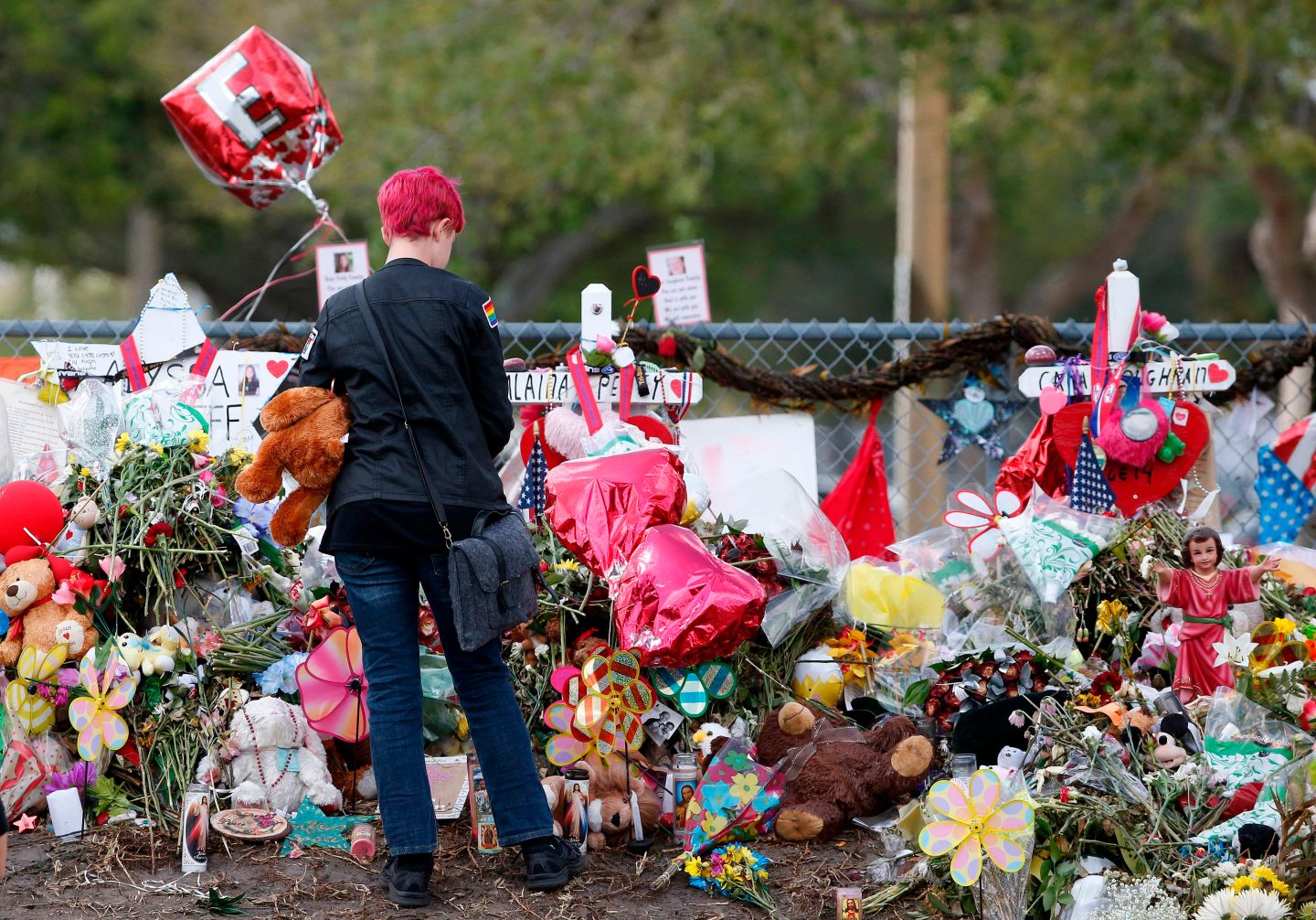 A Marjory Stoneman Douglas High School student at a memorial following students' return to school in Parkland, Florida on February 28, 2018.