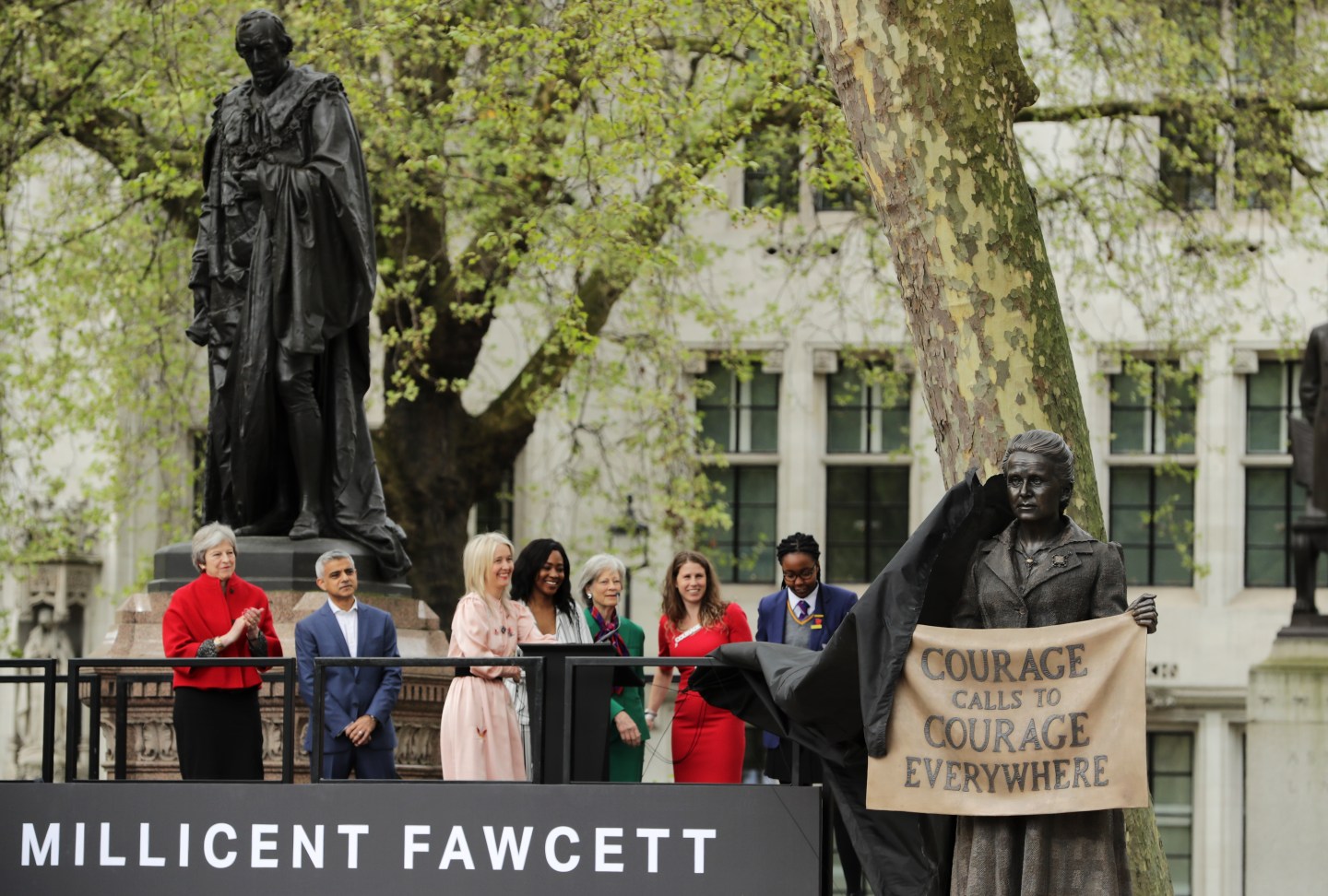 Black veil is pulled off statue to reveal Millicent Fawcett's likeness