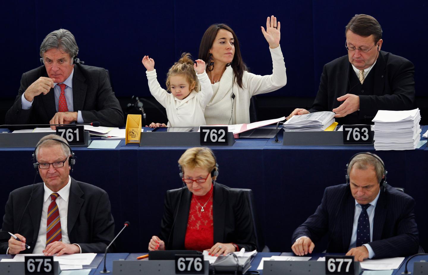 Italy's Member of the European Parliament Ronzulli takes part with her daughter Victoria in a voting session at the European Parliament in Strasbourg