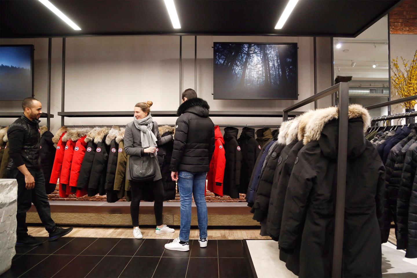 Shoppers browsing Canada Goose’s parkas in Manhattan flagship store.