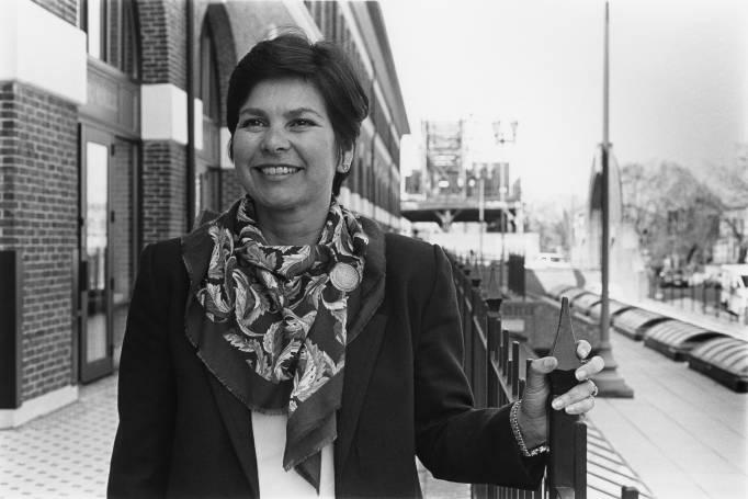 Anita Perez Ferguson standing by fence