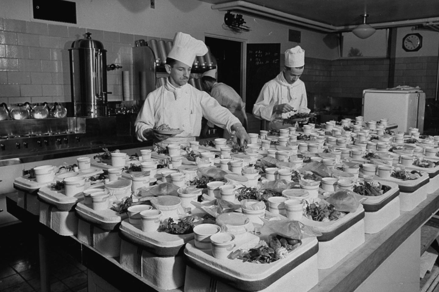 A view of chefs preparing food from a st