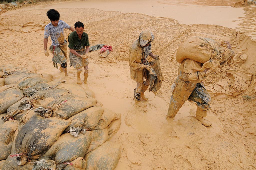 Labourers work at the site of a rare earth metals mine at Nancheng county, Jiangxi province