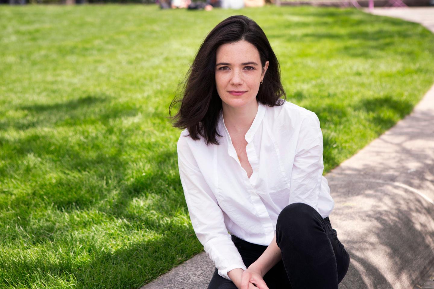 Google employee Claire Stapleton sitting on grass