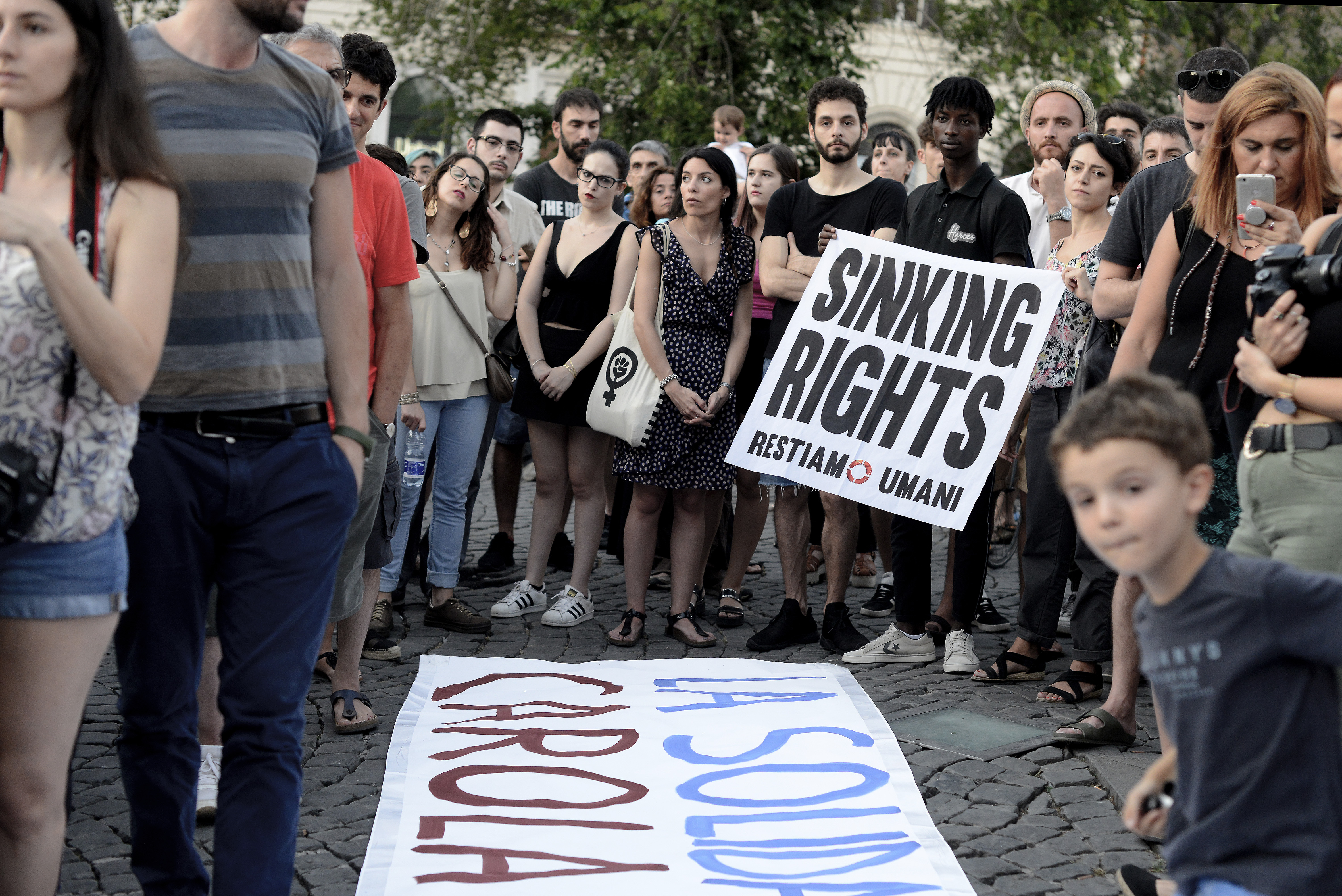 ROME, ITALY - JUNE 29: Hundreds of people protest in Piazza dell'Esquilino to ask for the release of Carola Rackete, the captain of the Sea-Watch 3 migrant-rescue ship arrested in Lampedusa for having rescued 42 migrants against the Guardia di Finanza cell order and also protest against the security decree of Minister Matteo Salvini, on June 29, 2019 in Rome, Italy. (Photo by Simona Granati - Corbis/Getty Images,)