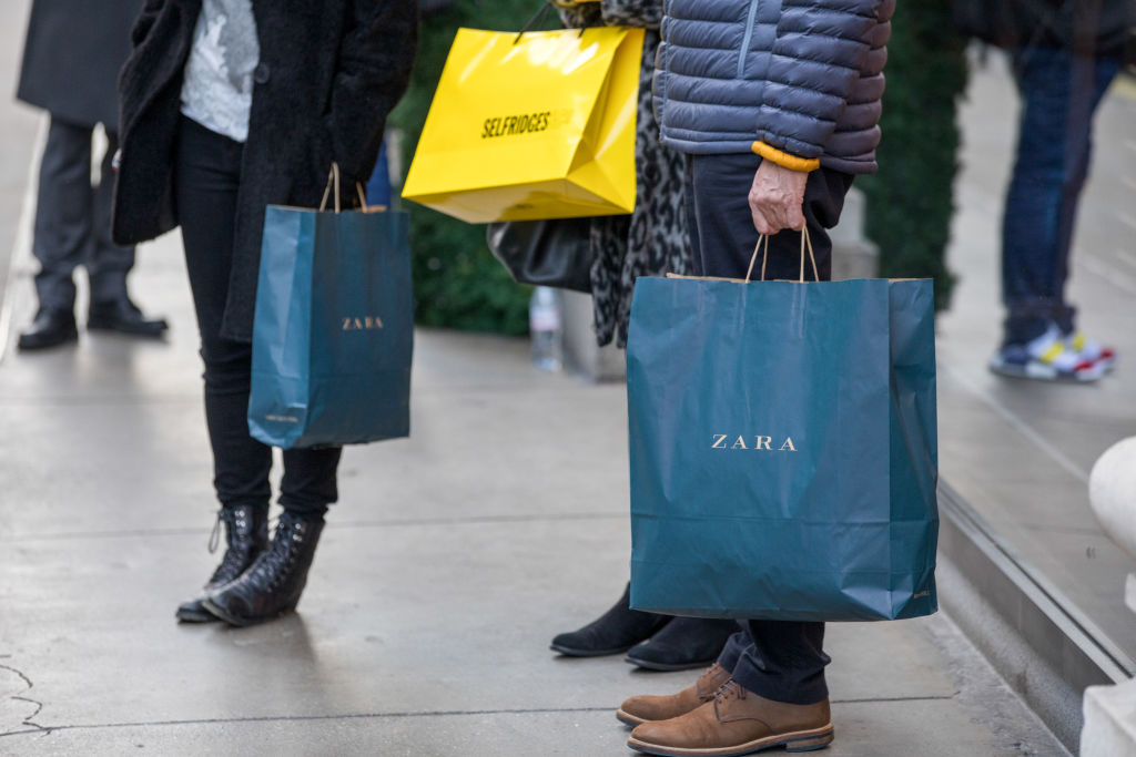 Shoppers carry Zara bags in the U.K.