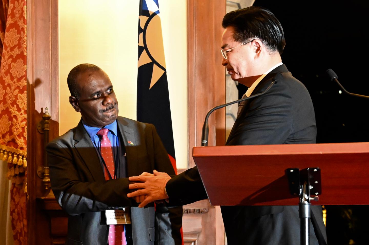 Taiwan's Foreign Minister Joseph Wu (R) shakes hands with Solomon Islands' Foreign Minister Jeremiah Manele (L) during a press conference at the Taipei Guest House in Taipei on September 9, 2019. - Taiwan's president on September 9 urged the Solomon Islands not to switch diplomatic allegiance to China, as the Pacific nation deliberates whether to recognise the far more economically powerful Beijing instead. (Photo by Sam YEH / AFP) (Photo credit should read SAM YEH/AFP/Getty Images)