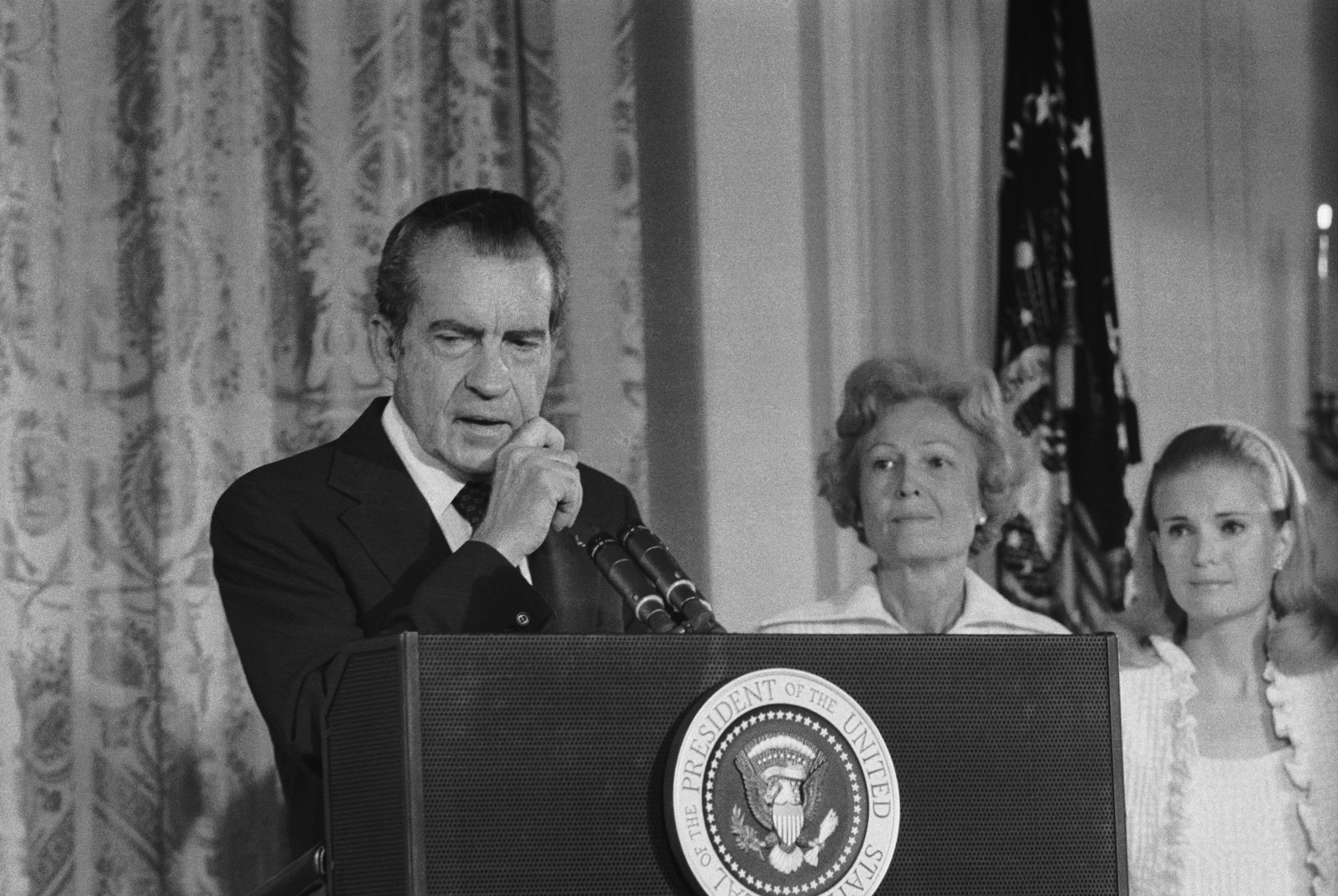 President Richard Nixon says an emotional farewell to his staff and cabinet in the East Room of the White House after resigning from office. His wife, Pat, and daughter Tricia are at right.