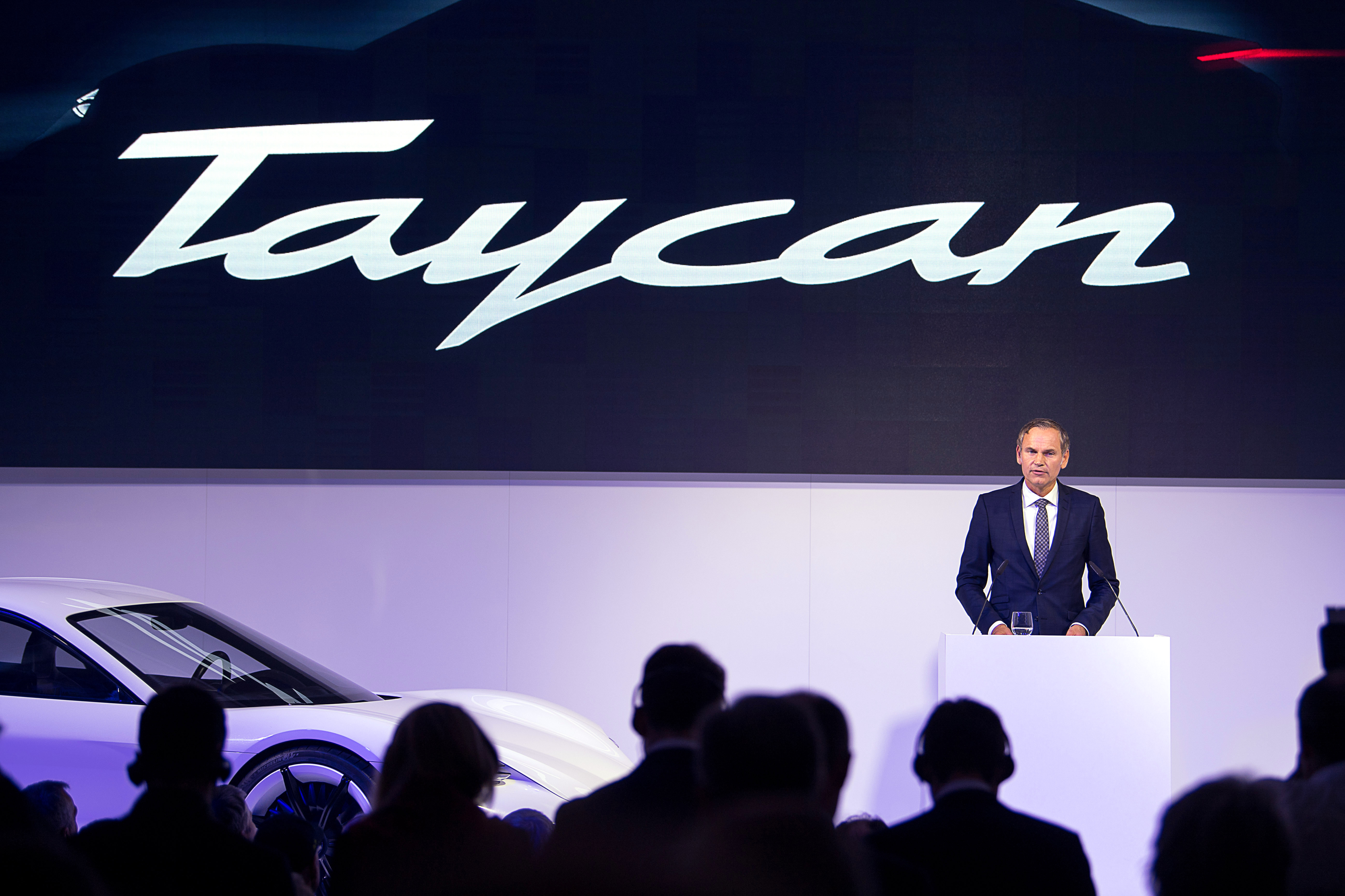 08 June 2018, Germany, Stuttgart: Oliver Blume, CEO of Porsche AG, presents the name of the company's first electric car as "Taycan", Porsche's competitor to the Tesla Model S.