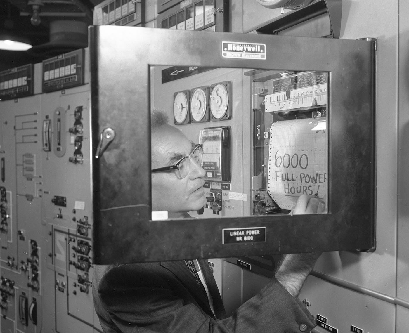 Many Gen IV designs have been around for decades. Here Alvin Weinberg, who developed an experimental molten salt reactor at the U.S'.s Oak Ridge National Laboratory in the 1960s, marks 6,000 hours of its operation in 1967. ORNL is now part of the Department of Energy. [Photo from ORNL].