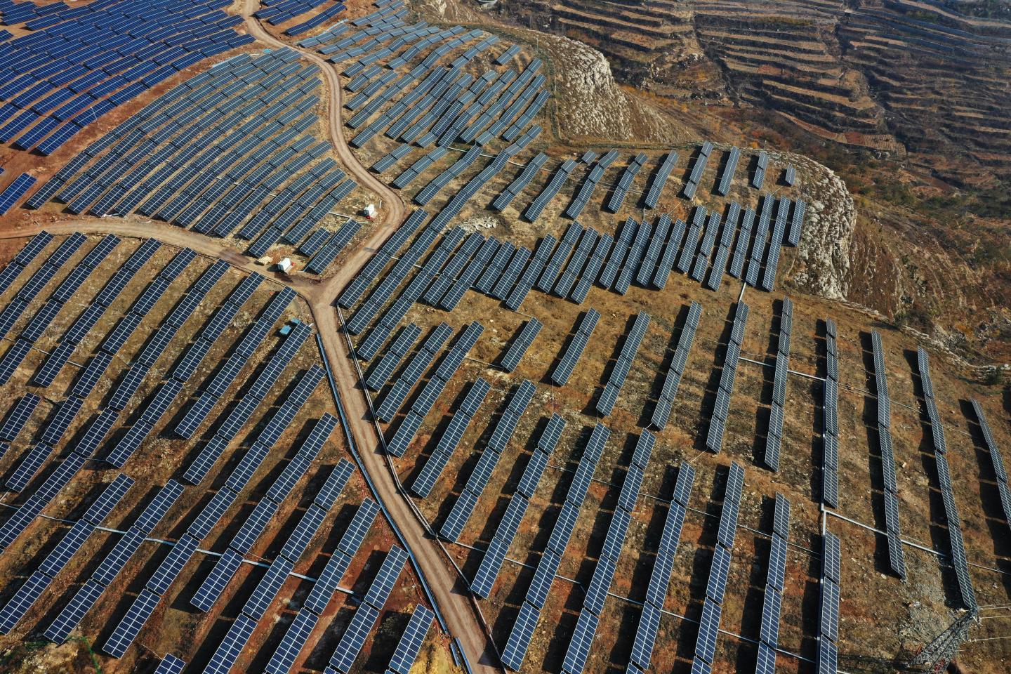 Aerial view of a photovoltaic power generation project on barren hills on November 26, 2019 in Zaozhuang, Shandong Province of China. China's power generation rose 3.1 percent year-on-year to 5.9 trillion kilowatt hours in the first ten months of the year, according to National Bureau of Statistics (NBS). (Photo by Li Zongxian/VCG via Getty Images)