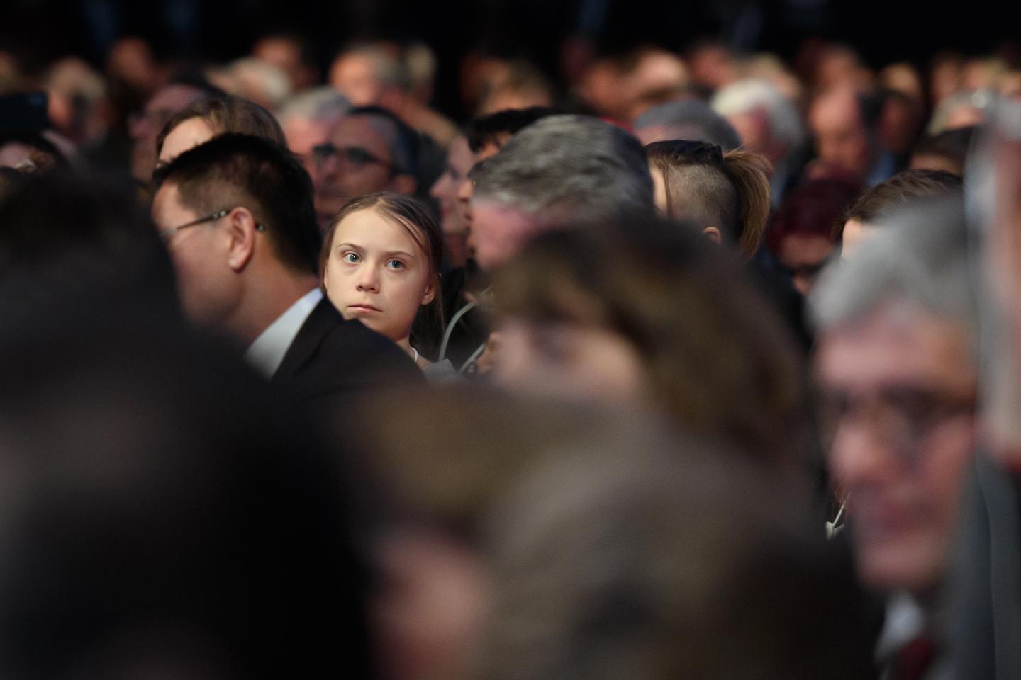 Swedish climate activist Greta Thunberg listens to the speech of US President at the Congress hall during the World Economic Forum (WEF) annual meeting in Davos, on January 21, 2020. (Photo by Fabrice COFFRINI / AFP) (Photo by FABRICE COFFRINI/AFP via Getty Images)