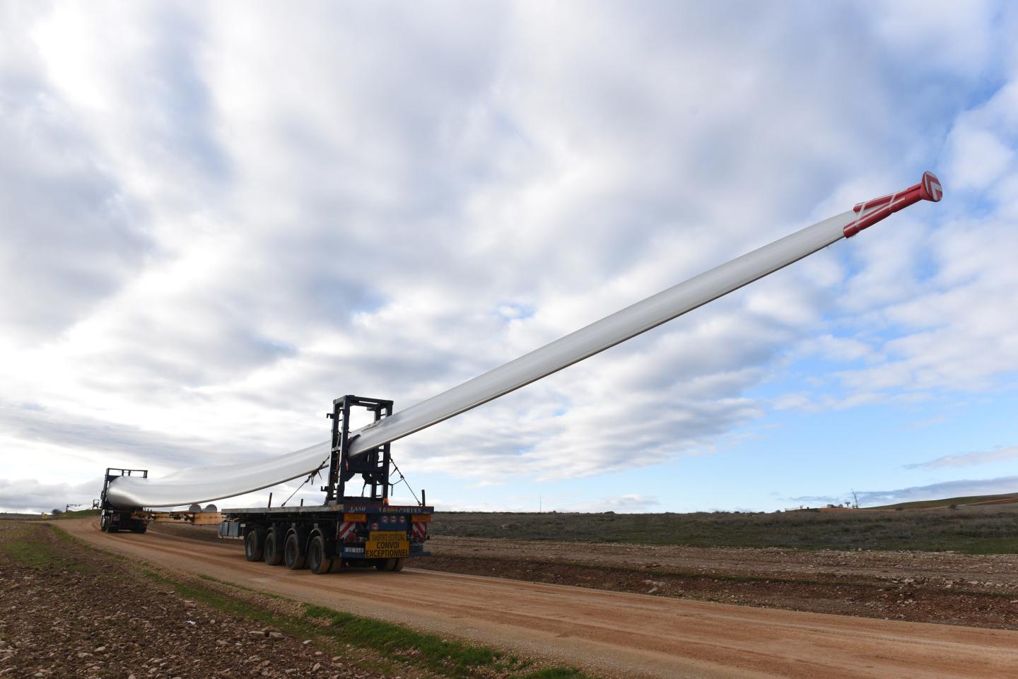 MADRID, SPAIN - 2019/12/05: Special transport truck is seen transporting the blade of a wind turbine near the small village of Beltejar. Construction work continues on a new wind farm in Beltejar, north of Spain. During COP25, the Spanish president Pedro Sanchez pledged to reduce the level of CO2 emissions by 20% in the next years. (Photo by John Milner/SOPA Images/LightRocket via Getty Images)
