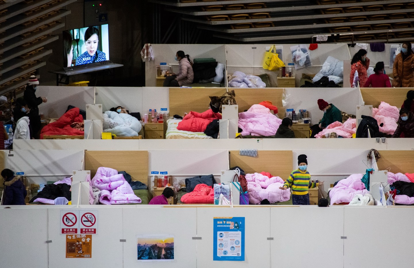 WUHAN, CHINA - FEBRUARY 18, 2020 - Patients at night in the Fangcang hospital, Wuhan, Hubei Province, China, February 18, 2020.- PHOTOGRAPH BY Costfoto / Barcroft Media (Photo credit should read Costfoto/Barcroft Media via Getty Images)