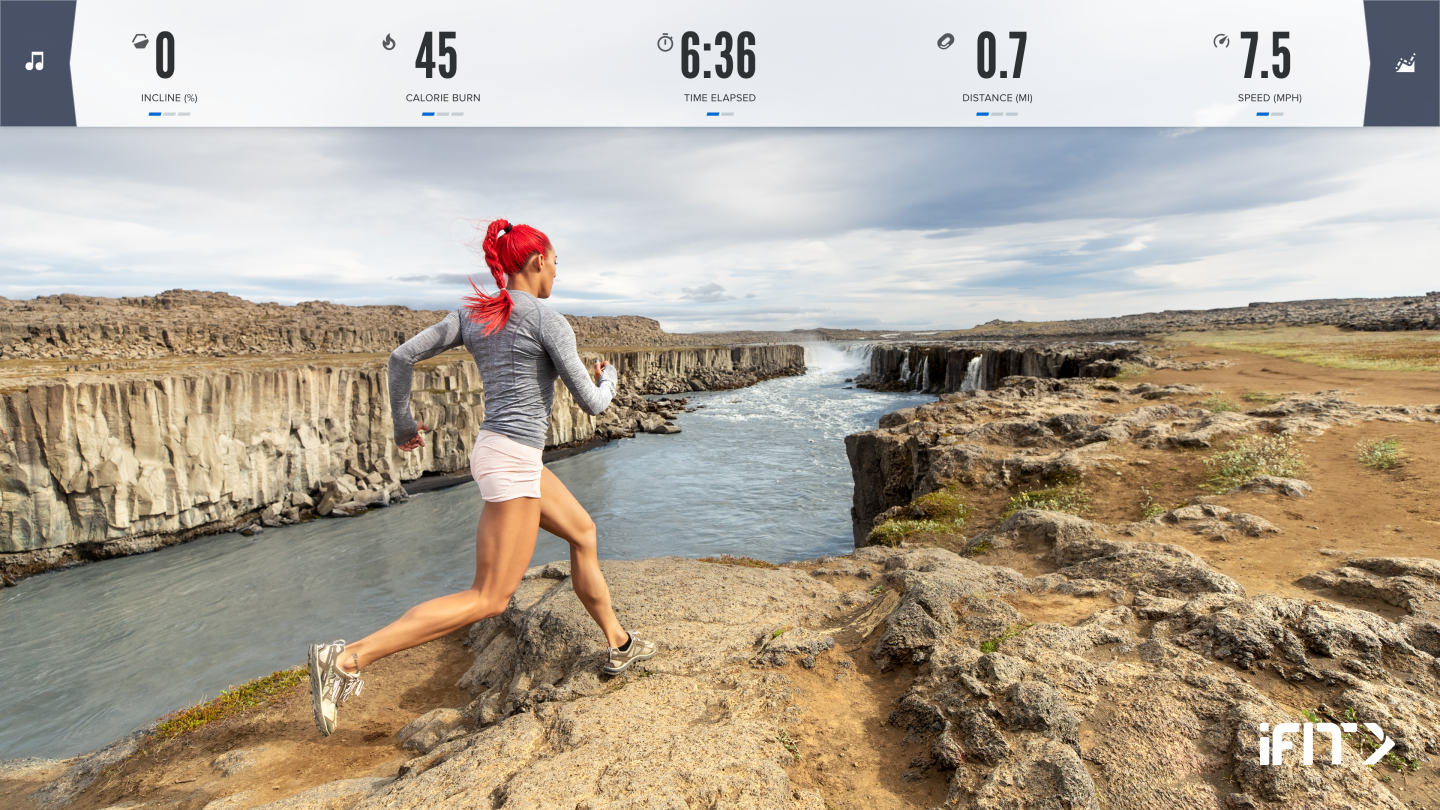 An image of a treadmill user using iFit to simulate running in Iceland.
