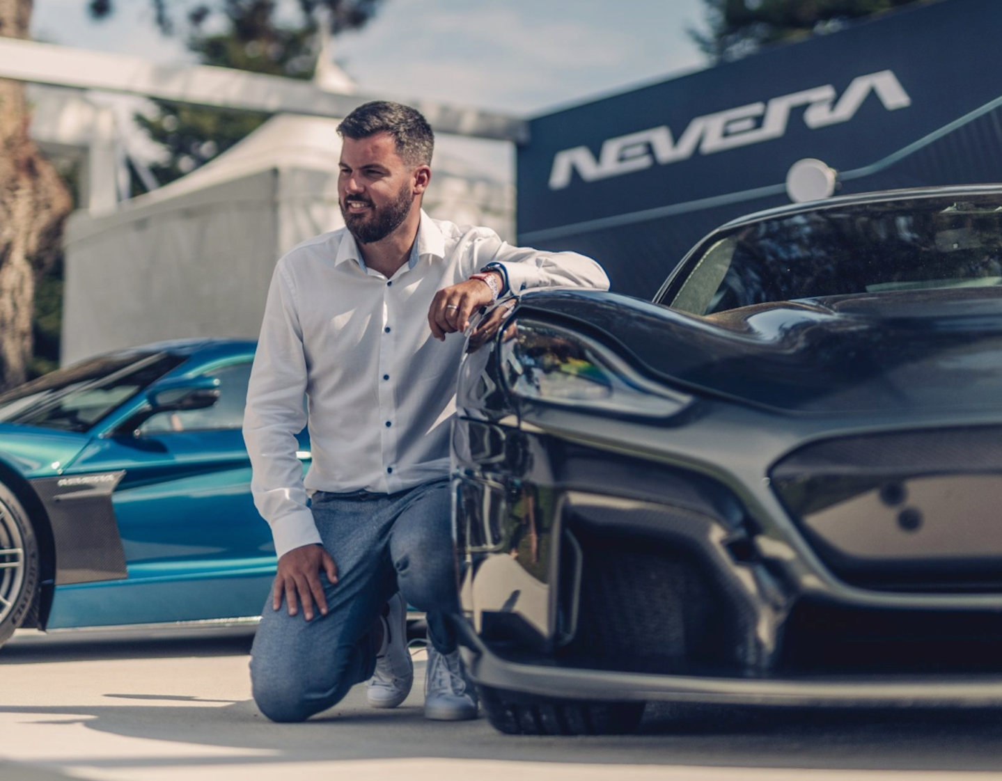 Founder Mate Rimac next to the Nevera hypercar