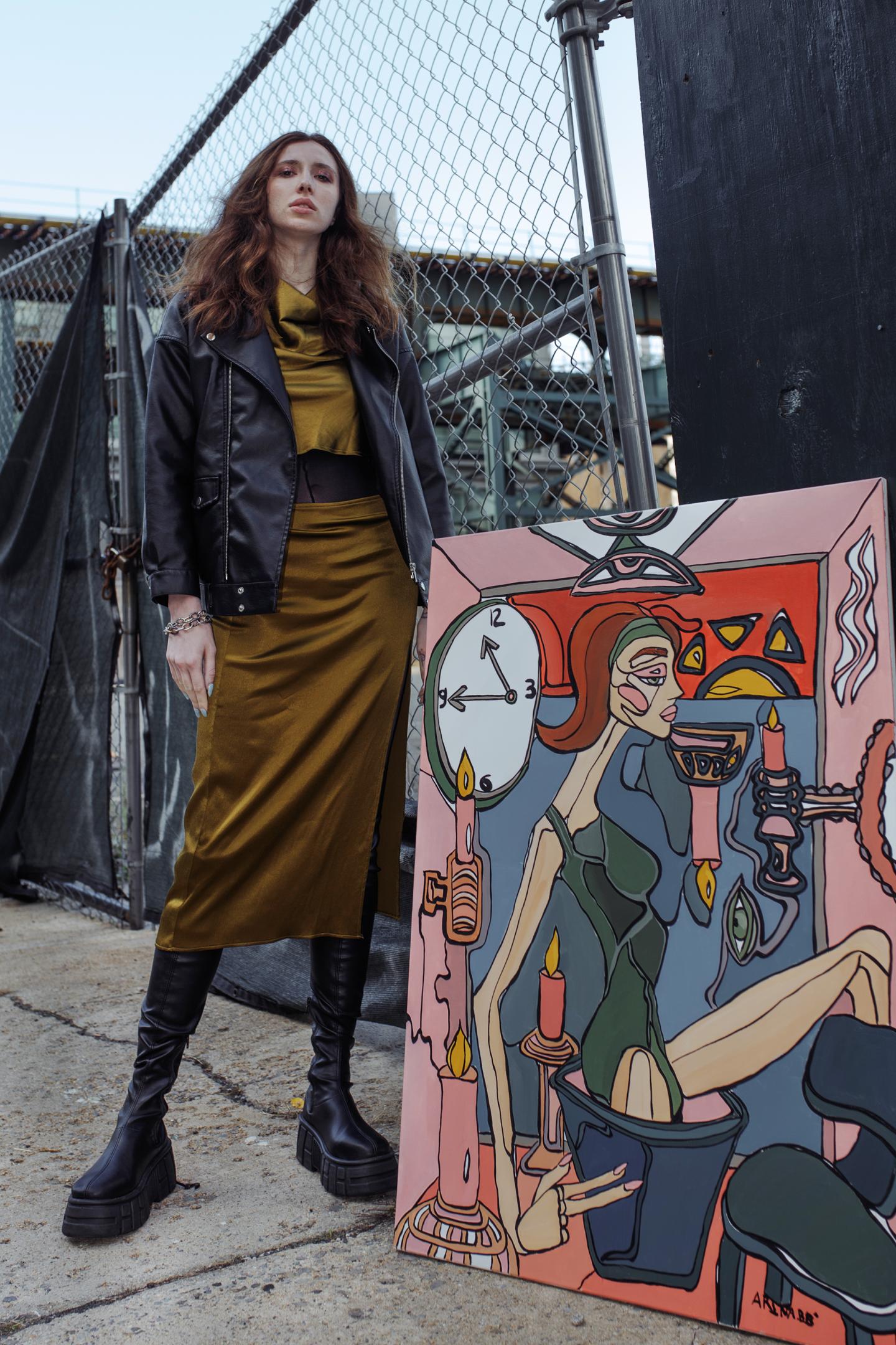 NFT artist ArinaBB poses with a piece from her ManManLaiZzz collection.