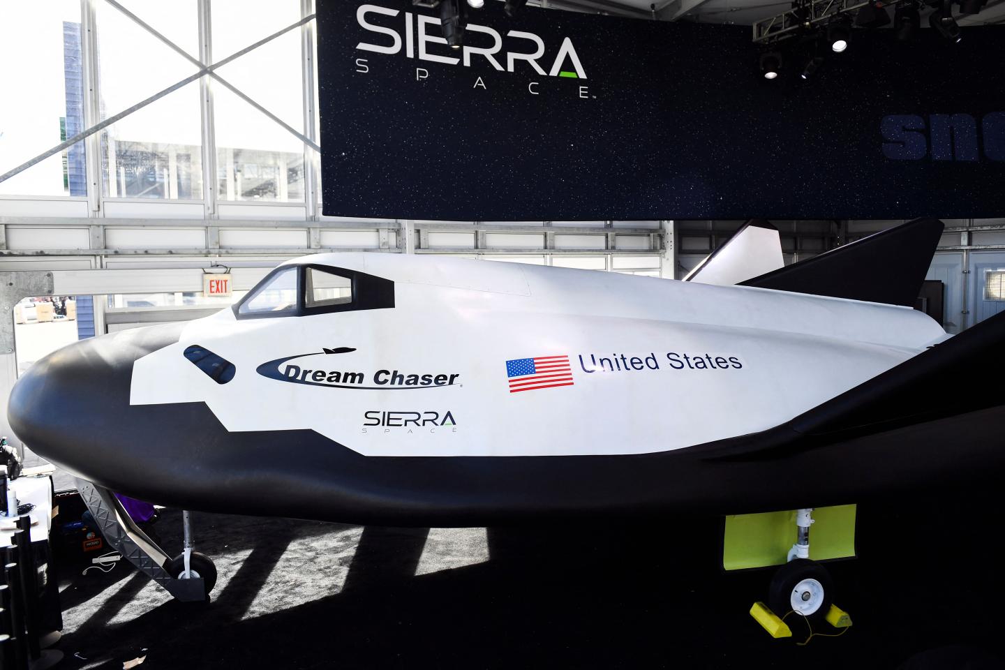 A full sized crew model of the Sierra Space Dream Chaser space plane.