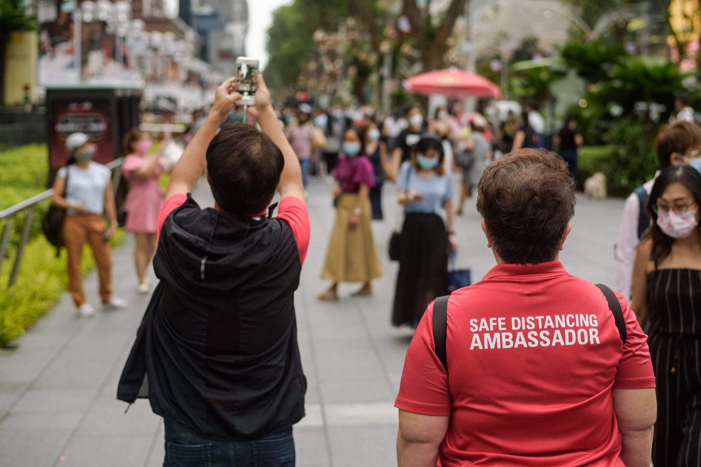 Photo of a safe-distancing ambassador at work in Singapore