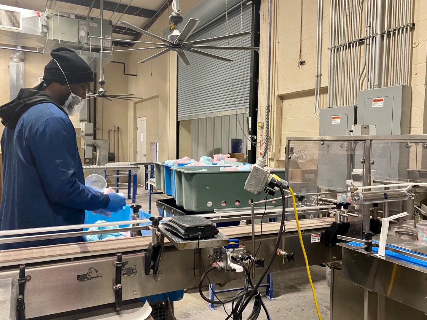 Photo of a McJak Candy employee packaging cotton candy
