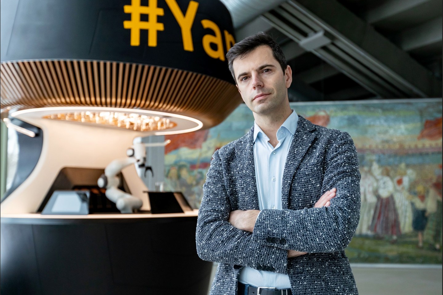 Yanu CEO Alan Adojaan and his company’s robotic bartender