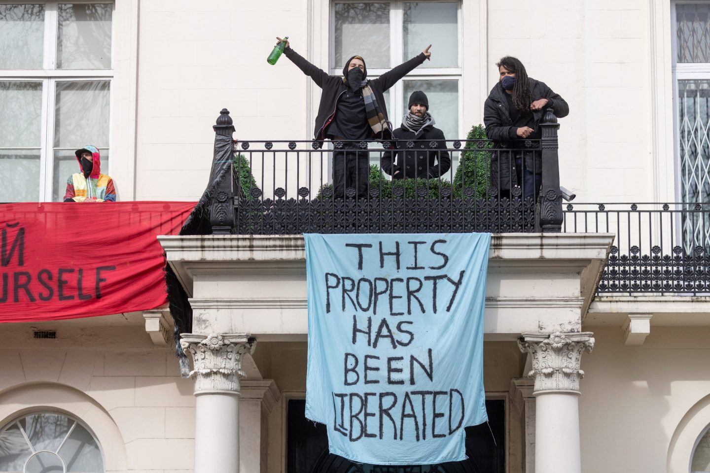 People protesting the invasion of Ukraine occupy a mansion