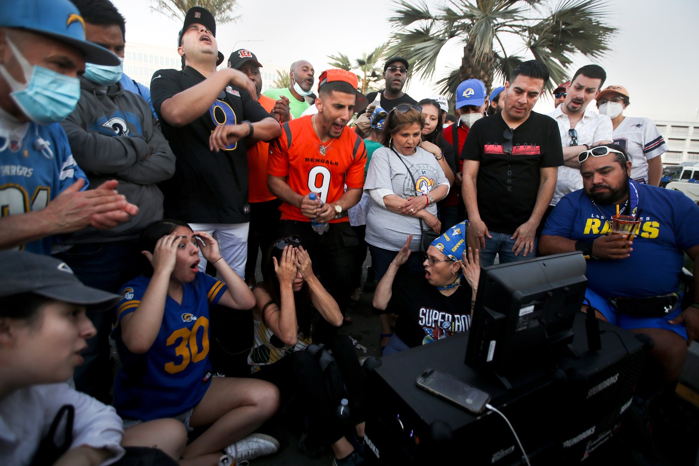 L.A. Rams and Cincinnati Bengals fans watch the Super Bowl outside SoFi Stadium on Feb. 13, 2022, in Inglewood, Calif.