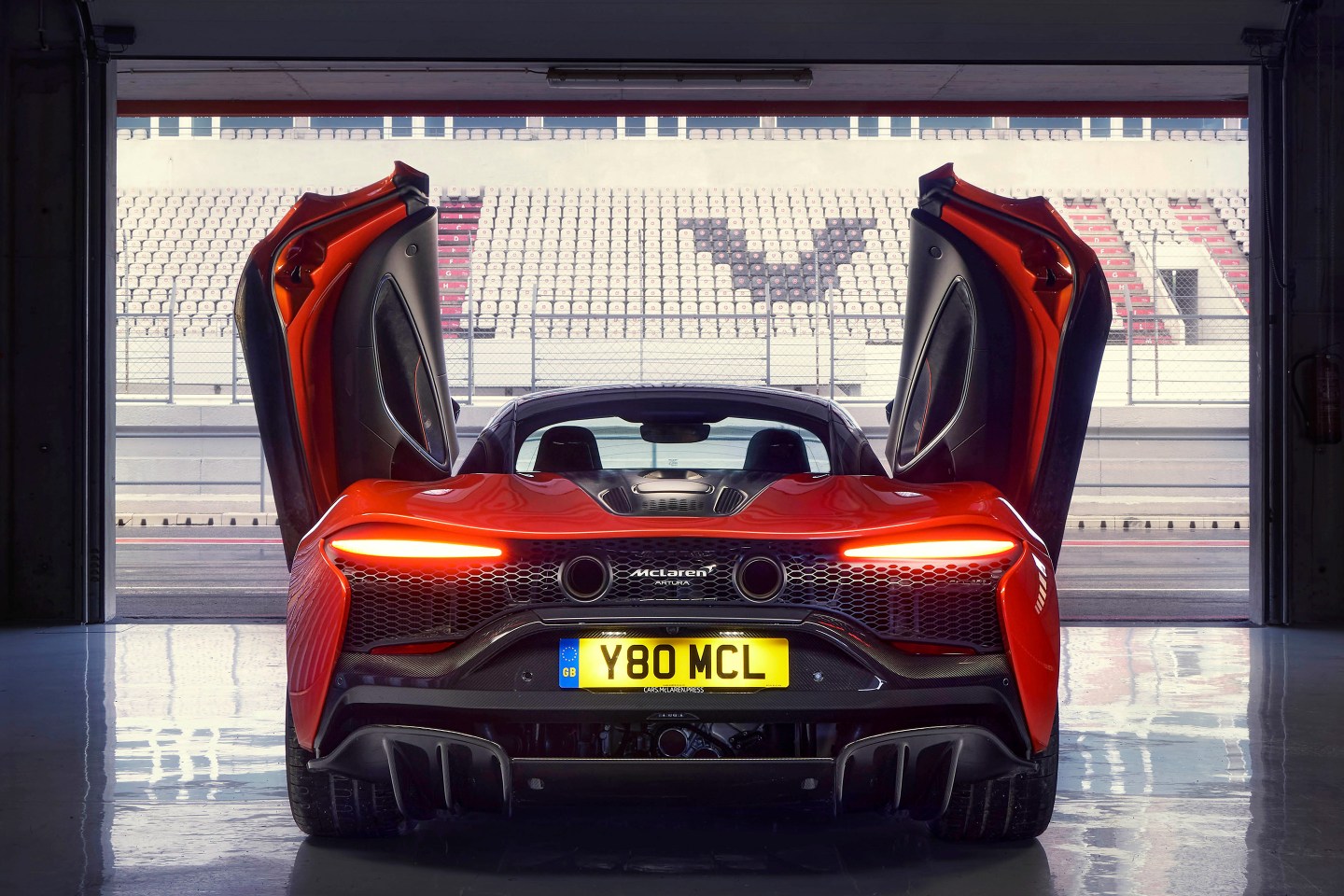 Red McLaren Artura hybrid model.
