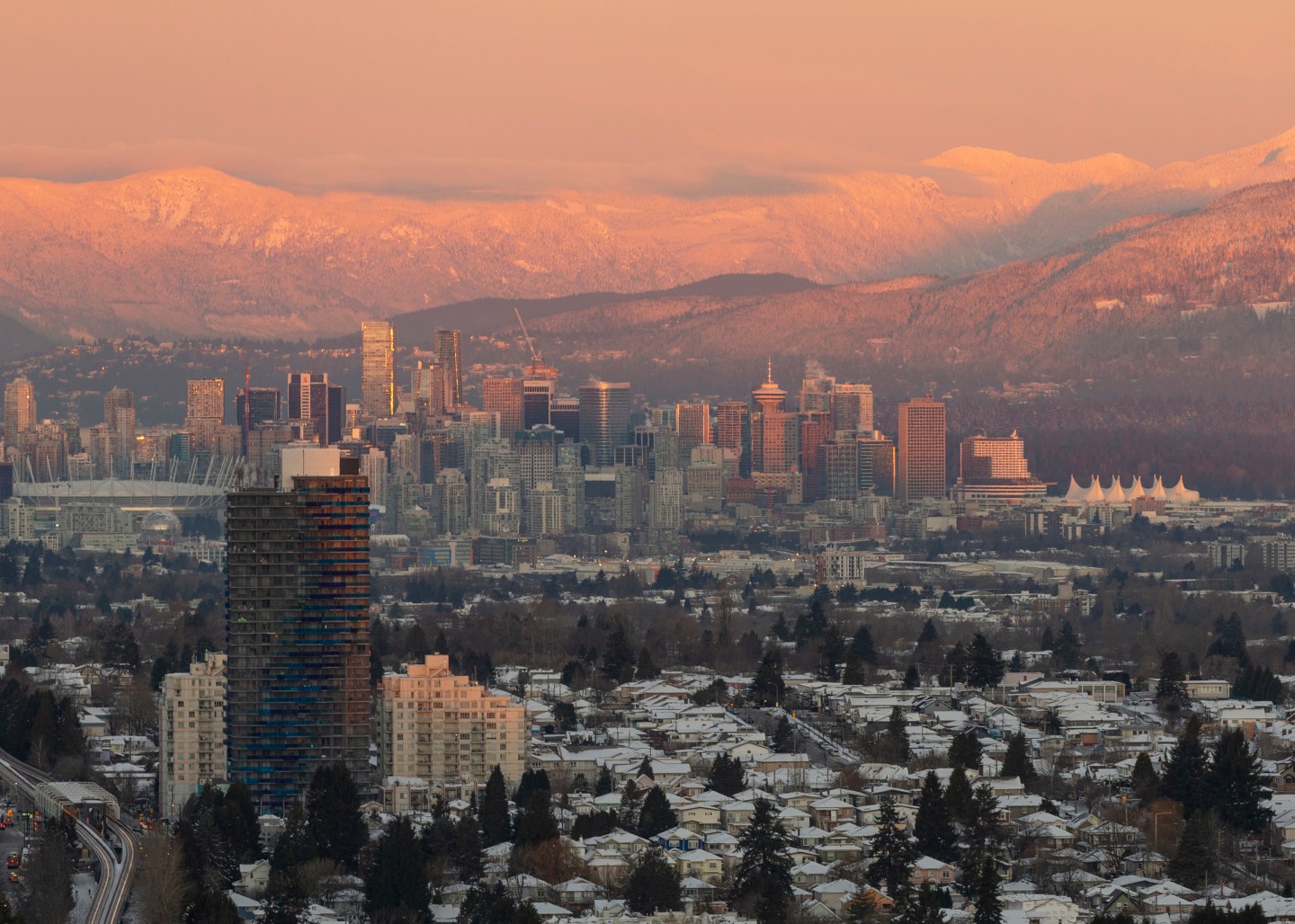 A photo depicting the downtown Vancouver skyline during sunrise on December 29, 2021.