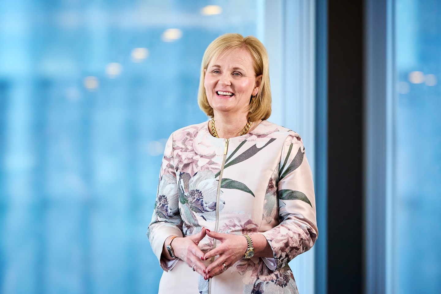Aviva CEO Amanda Blanc poses for a portrait in an office.